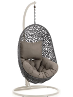 JARI suspended armchair in woven rattan with steel frame and and cushions included for indoor or outdoor